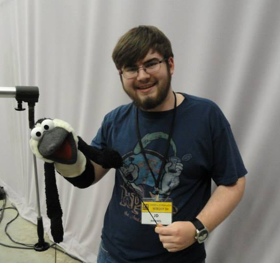J.D. with a penguin puppet.